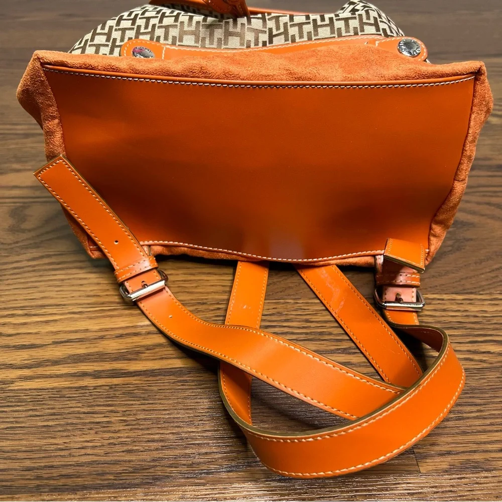 Tommy Hilfiger backpack in orange and brown with a monogram logo print